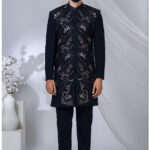Black Navabi suit with multicolored floral embroidery and mandarin collar.