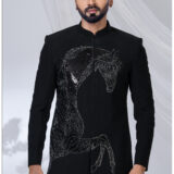 Man wearing a black Jodhpuri suit with an embroidered sequined horse design and mandarin collar.