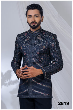 Man wearing a midnight blue Jodhpuri suit with intricate peacock and floral embroidery, styled with a mandarin collar.