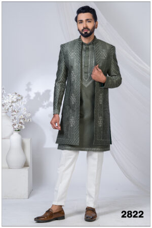 Man wearing an olive green open Indo Western sherwani with geometric embroidery and floral detailing.