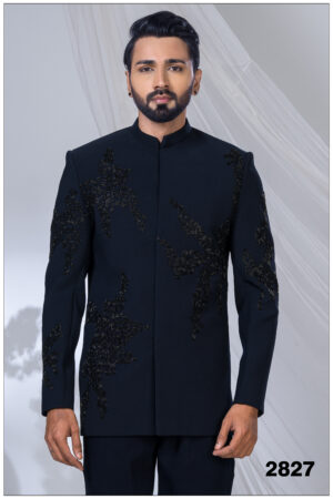 Man wearing a black Jodhpuri suit with abstract bead embroidery and mandarin collar.