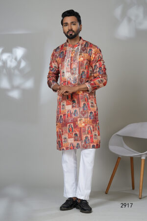Man wearing a multicolored kurta with traditional miniature painting motifs and mirror work, paired with white pants—an artistic, festive, ethnic outfit.