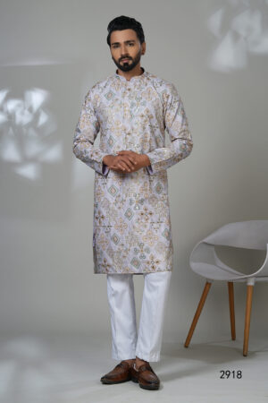 Man wearing a lilac embroidered kurta with mirror and thread work, white trousers, and brown shoes — a statement ethnic wear look.