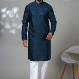 Men’s navy blue kurta with intricate embroidery and white trousers