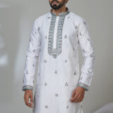 Men’s white kurta with blue-grey embroidery and detailed hem