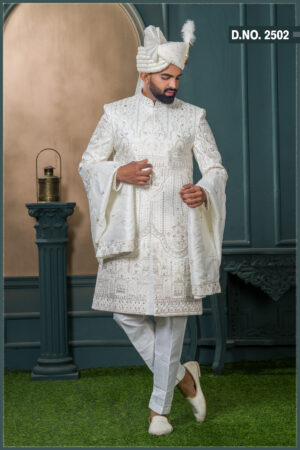 Ivory silk groom sherwani with architectural embroidery and pastel detailing