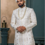 Ivory silk sherwani with floral zari and sequin embroidery for groom