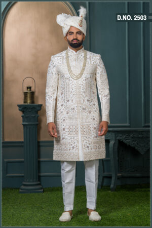 Ivory silk sherwani with floral zari and sequin embroidery for groom.
