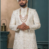 Ivory malai silk sherwani with golden zari and floral embroidery for groom