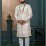 Ivory malai silk sherwani with golden zari and floral embroidery for groom