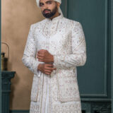 Ivory malai silk sherwani with red thread and zari embroidery for groom