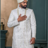 Ivory silk sherwani with self-tone zari and sequin embroidery for groom