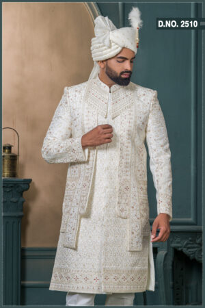 Ivory sherwani with zardosi and resham embroidery, detailed floral and geometric motifs, and maroon thread highlights on a rich jacquard fabric.