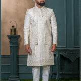 Ivory sherwani with zardosi and resham embroidery, detailed floral and geometric motifs, and maroon thread highlights on a rich jacquard fabric.