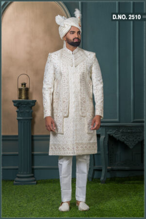 Ivory sherwani with zardosi and resham embroidery, detailed floral and geometric motifs, and maroon thread highlights on a rich jacquard fabric.