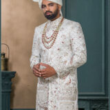 Ivory silk groom sherwani with architectural and floral zari embroidery