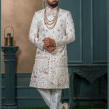 Ivory silk groom sherwani with architectural and floral zari embroidery