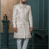 Ivory brocade groom sherwani with elephant and floral zari embroidery