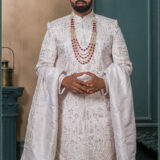 Ivory silk groom sherwani with matching dupatta and intricate thread embroidery