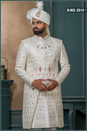 Ivory brocade sherwani with handcrafted elephant embroidery and detailed zari work for groom