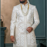 Ivory silk sherwani with golden zari embroidery and pearl accessories for groom