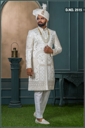 Ivory silk sherwani with golden zari embroidery and pearl accessories for groom