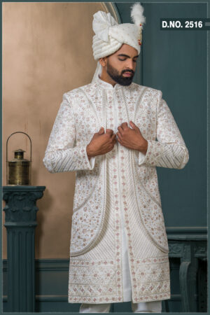 Ivory brocade sherwani with red and gold embroidery for groom wedding wear