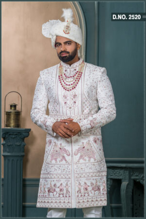Ivory sherwani with heritage embroidery featuring royal motifs of elephants and musicians for wedding wear