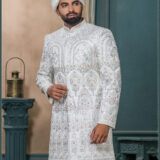 Ivory sherwani with silver and pastel embroidery featuring royal arch motifs, perfect for wedding wear.