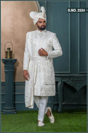 White embroidered sherwani with resham and mirror detailing, designed for a royal groom look.